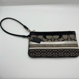 Coach wristlet black and striped coach print